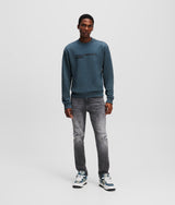 DISTRESSED SLIM JEANS